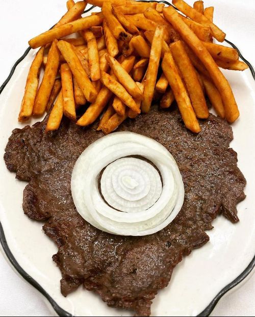 Bistec encebollado with french fries
